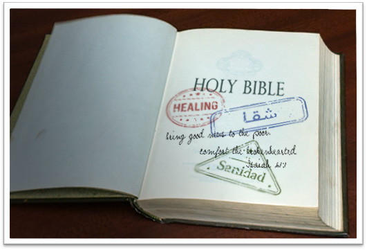 Open Holy Bible with passport-style stamps reading ‘Healing,’ ‘شفا,’ and ‘Sanidad,’ representing God’s Word bringing healing across cultures