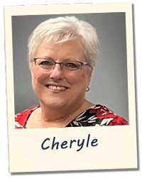 Cheryle, smiling, in a labeled polaroid-style snapshot